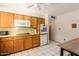 Kitchen features light wood cabinets, matching appliances, and tiled flooring at 509 N 56 St, Mesa, AZ 85205