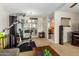 Comfortable living room with exercise equipment and open floor plan with dining area at 509 N 56 St, Mesa, AZ 85205