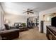Comfortable living room with carpet, ceiling fan and open floor plan with dining area at 509 N 56 St, Mesa, AZ 85205