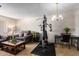 Cozy living room features exercise equipment, comfortable seating, and natural light at 509 N 56 St, Mesa, AZ 85205