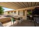 Rear covered patio providing an area for outdoor dining and entertaining guests at 509 N 56 St, Mesa, AZ 85205
