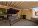 Covered patio featuring a swing and plenty of room for backyard BBQs and outdoor relaxing at 509 N 56 St, Mesa, AZ 85205