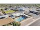 Aerial view of a home featuring a backyard swimming pool, spa, covered patio, and fenced in yard at 6433 E University Dr, Mesa, AZ 85205