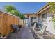 Backyard patio with patio furniture, planters, and gravel at 6433 E University Dr, Mesa, AZ 85205