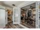 Open floorplan dining area with modern flooring, fan, and door to laundry room at 6433 E University Dr, Mesa, AZ 85205