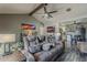 Open-concept living room seamlessly connects to the kitchen, providing a spacious and inviting atmosphere for relaxation and socializing at 6433 E University Dr, Mesa, AZ 85205