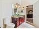 Bathroom with granite countertop, and sinks, and a view to a bedroom at 12547 W Edgemont Ave, Avondale, AZ 85392