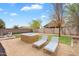 Serene backyard with a hot tub and lounge chairs perfect for relaxation at 1380 W Angus Rd, San Tan Valley, AZ 85143