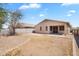 Expansive backyard featuring desert landscaping, a covered patio, and block wall fencing for privacy at 1380 W Angus Rd, San Tan Valley, AZ 85143