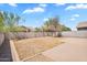 Spacious backyard with desert landscape, brick-paved patio, and secure block wall for added privacy at 1380 W Angus Rd, San Tan Valley, AZ 85143