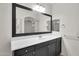Bathroom boasts a large mirror and a dark vanity providing plenty of storage and counter space at 1380 W Angus Rd, San Tan Valley, AZ 85143