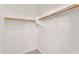 Bright, empty closet with ample space and wooden rods at 1380 W Angus Rd, San Tan Valley, AZ 85143