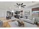 Bright living room with modern decor and adjacent kitchen area, perfect for entertaining and comfortable living at 1380 W Angus Rd, San Tan Valley, AZ 85143