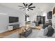 Open-concept living space with modern finishes, seamlessly connecting the living room, kitchen, and dining areas at 1380 W Angus Rd, San Tan Valley, AZ 85143