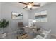 Modern home office with natural light, glass desk, and stylish decor at 1380 W Angus Rd, San Tan Valley, AZ 85143