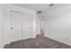 Bedroom featuring white sliding door closet and a view through the doorway at 14241 W Bronco Trl, Surprise, AZ 85387