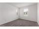 Neutral carpet bedroom with bright, shuttered windows at 14241 W Bronco Trl, Surprise, AZ 85387