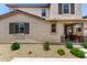 Close up showing the detailed architectural design of the two story home at 14241 W Bronco Trl, Surprise, AZ 85387