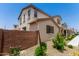 Back yard view showcasing the home's backyard, privacy fence, and lush greenery at 14241 W Bronco Trl, Surprise, AZ 85387