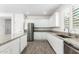 Well-equipped kitchen with granite countertops, stainless steel appliances, and ample cabinet space at 14241 W Bronco Trl, Surprise, AZ 85387