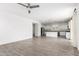 Open-concept living room, seamlessly connecting to the kitchen and dining areas at 14241 W Bronco Trl, Surprise, AZ 85387