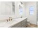 Double vanity bathroom with quartz countertops, and modern lighting at 15582 W Jomax Rd, Surprise, AZ 85387