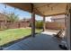 A view of the spacious backyard and covered patio at 17056 W Bristol Ln, Surprise, AZ 85374