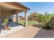 Spacious backyard with rock and a covered patio at 17056 W Bristol Ln, Surprise, AZ 85374