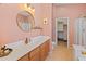 Spacious bathroom features a white countertop, wooden cabinetry, and a separate shower and toilet area at 17056 W Bristol Ln, Surprise, AZ 85374