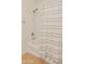 Bathroom with a shower/tub combination and striped shower curtain at 17056 W Bristol Ln, Surprise, AZ 85374