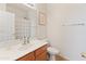 Bright bathroom features a sink, vanity, mirror, and a toilet at 17056 W Bristol Ln, Surprise, AZ 85374