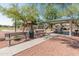 Community park featuring covered picnic area, playground, green space, and walkways at 17056 W Bristol Ln, Surprise, AZ 85374