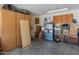 Spacious garage with storage cabinets, refrigerator, and ample storage boxes at 17056 W Bristol Ln, Surprise, AZ 85374