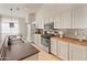 Well-equipped kitchen with stainless steel appliances, butcher block countertops, and ample white cabinetry at 17056 W Bristol Ln, Surprise, AZ 85374