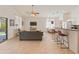 Open floor plan showcasing the seamless flow from the living room to the kitchen and dining area at 17056 W Bristol Ln, Surprise, AZ 85374
