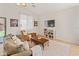 Inviting living room features neutral decor, plush seating, and access to the outdoor living space at 17056 W Bristol Ln, Surprise, AZ 85374