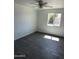 Bedroom featuring a large window that lets in natural light and tile floors at 1818 N 63Rd Ave, Phoenix, AZ 85035