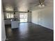 Open concept kitchen with granite counters, stainless steel sink, and tile flooring at 1818 N 63Rd Ave, Phoenix, AZ 85035