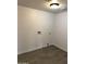 Laundry room with gray tile floors and hook ups for a washer and dryer at 1818 N 63Rd Ave, Phoenix, AZ 85035
