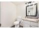 Bathroom featuring stylish granite counters, a framed mirror and traditional fixtures at 2406 S Mulberry --, Mesa, AZ 85202