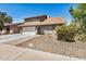 Inviting two-story home with attached garage, brick accents, and lush landscaping at 2406 S Mulberry --, Mesa, AZ 85202