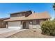 Traditional two story home features a two car garage and a covered front entryway at 2406 S Mulberry --, Mesa, AZ 85202