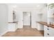 Home office features light gray walls, wood floors, a large window, and built in cabinets and shelving at 2406 S Mulberry --, Mesa, AZ 85202