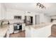 Updated kitchen with stainless steel appliances, granite countertops and a view to living room at 2406 S Mulberry --, Mesa, AZ 85202