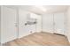 Clean laundry room with storage cabinets and wood look flooring at 2406 S Mulberry --, Mesa, AZ 85202