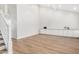 Bright living room features vaulted ceilings, wood floors, a staircase, and built in cabinets at 2406 S Mulberry --, Mesa, AZ 85202