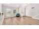 Light and airy living room with beautiful wood floors, vaulted ceilings, and a large front-facing window at 2406 S Mulberry --, Mesa, AZ 85202
