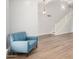 Living room features vaulted ceilings, wood flooring, comfortable seating and a staircase at 2406 S Mulberry --, Mesa, AZ 85202