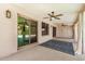 Covered patio with ceiling fans and sliding glass doors leading to indoor living spaces at 2406 S Mulberry --, Mesa, AZ 85202