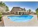 An inground pool is surrounded by a gray concrete area with a covered patio and fencing at 2406 S Mulberry --, Mesa, AZ 85202